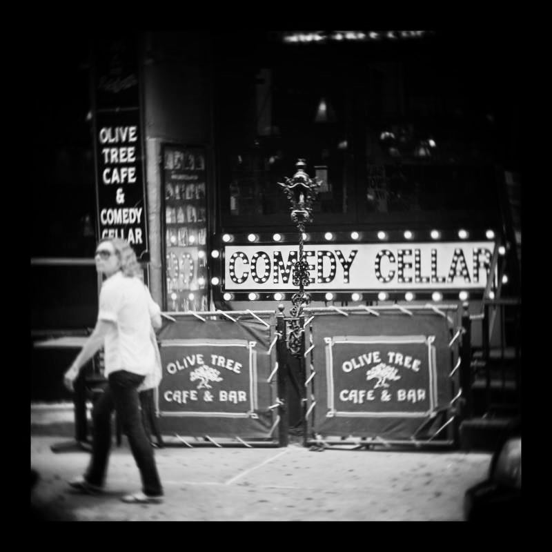 Guy walking by comedy cellar in new york city