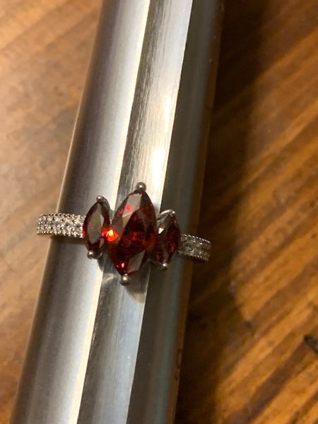 Silver-toned Costume Ring with Three Red Stones:  Three Grantings of Sanguine Power
