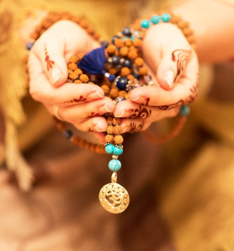 wearing buddhist prayer beads