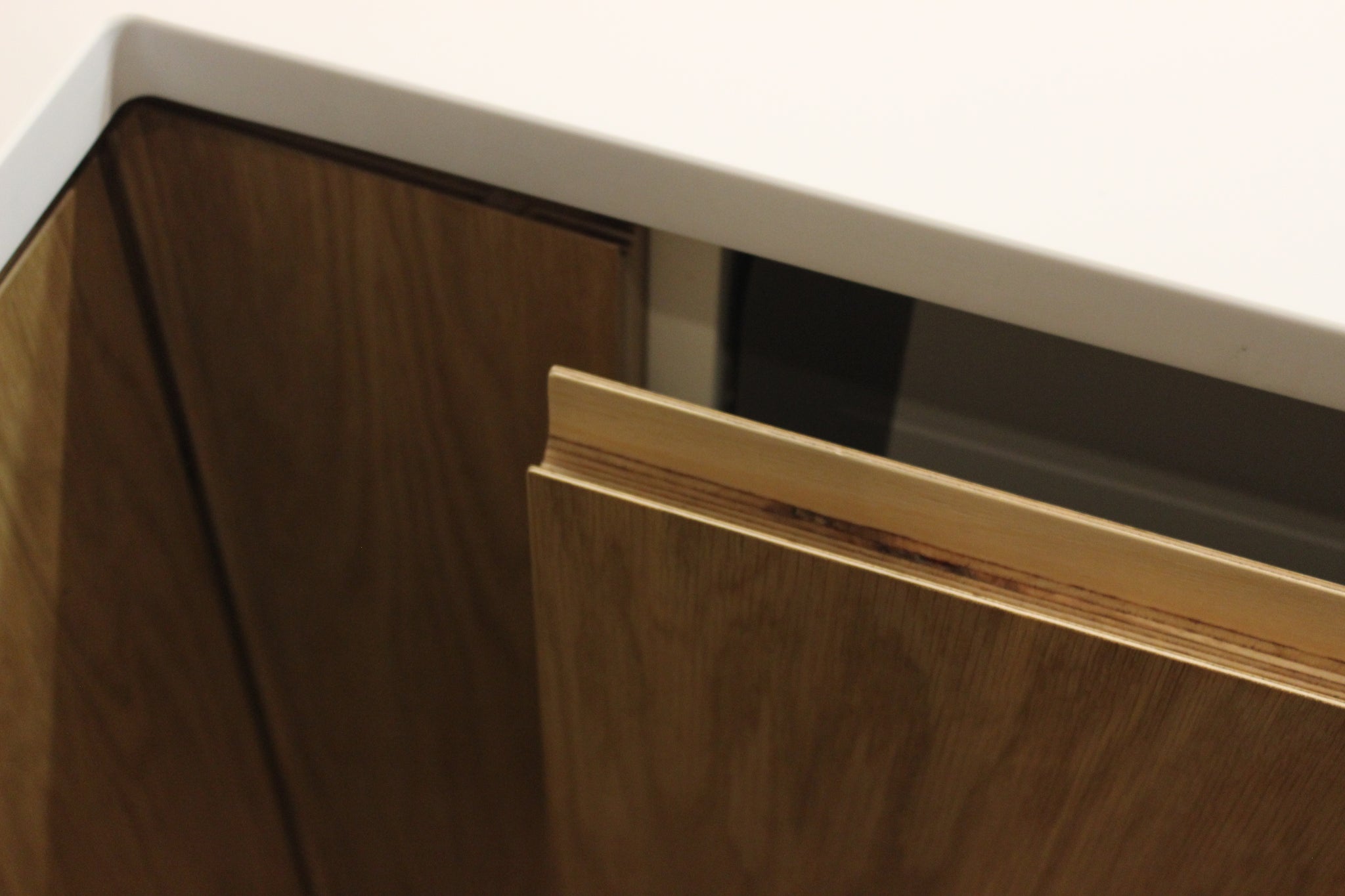 Bespoke kitchen with Corian worktop and oak doors.