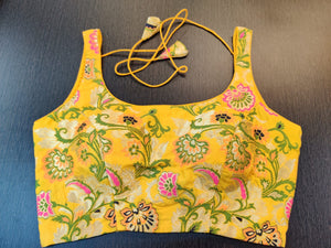 sleeveless yellow blouse