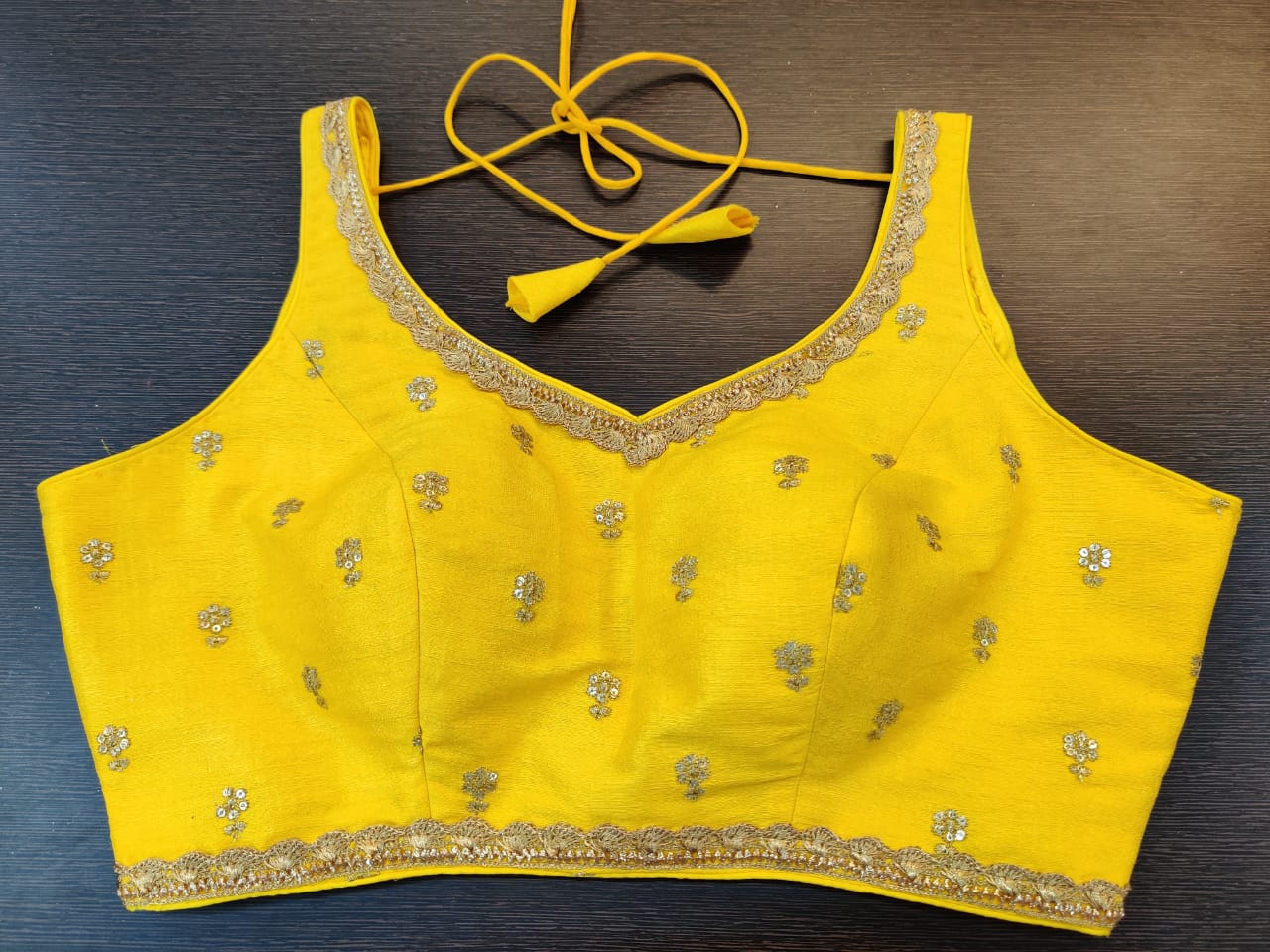 sleeveless yellow blouse