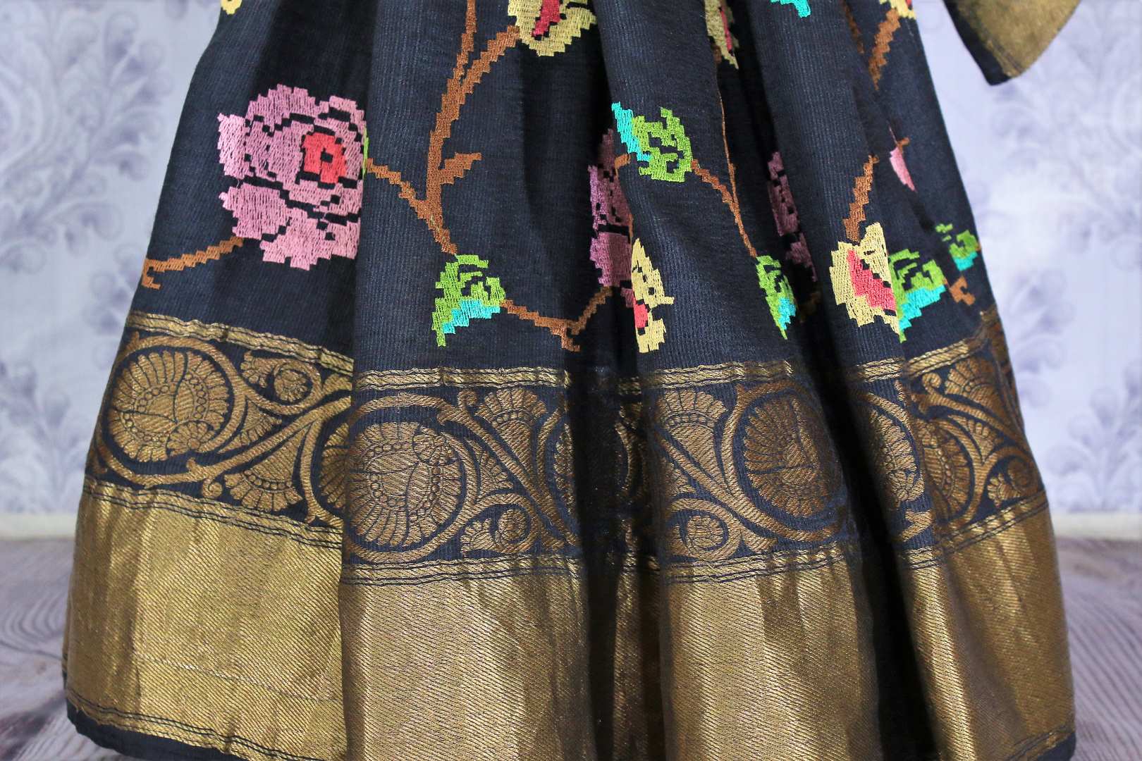 Buy elegant black muga silk saree online in USA with embroidery. The saree is a perfect choice for an ethnic sari look at special occasions. Buy more such Indian woven sarees, silk sarees in USA at Pure Elegance exclusive fashion store or shop online at the comfort of your home.-pleats