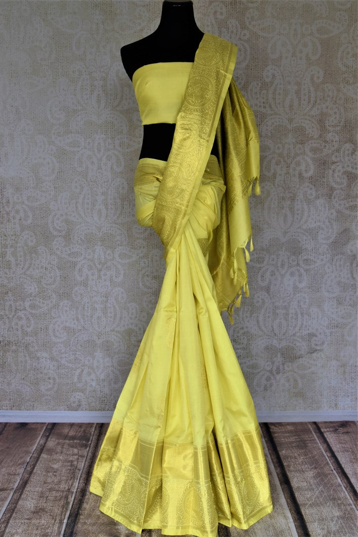 Buy lovely lemon yellow Kanjivaram saree online in USA with golden zari buta and zari border. Look rich and traditional at weddings and festive occasions with exquisite Kanchipuram silk sarees from Pure Elegance Indian fashion store in USA.-full view