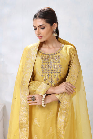 Shop gorgeous yellow embroidered sharara suit online in USA with dupatta. Flaunt Indian style at parties and weddings in beautiful designer dresses, salwar suits, Anarkali suits, gowns, palazzo suits from Pure Elegance Indian fashion store in USA.-closeup