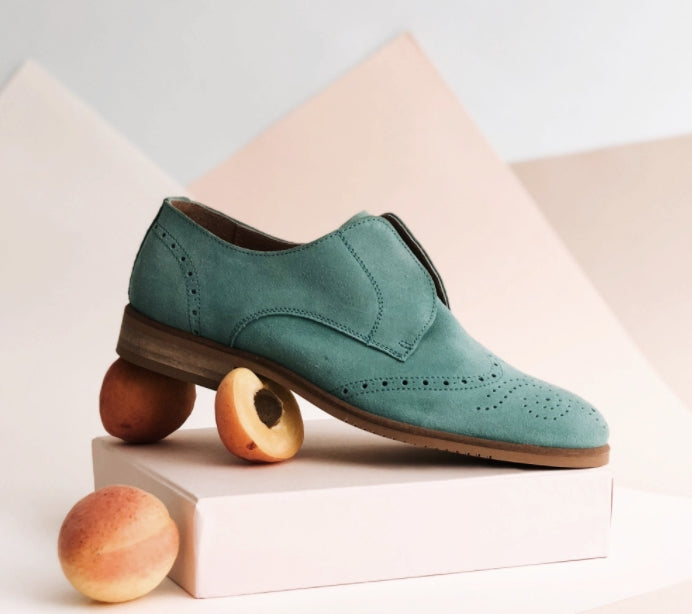 The Cottage Core Collection features vintage suede saddle shoes in mint green.