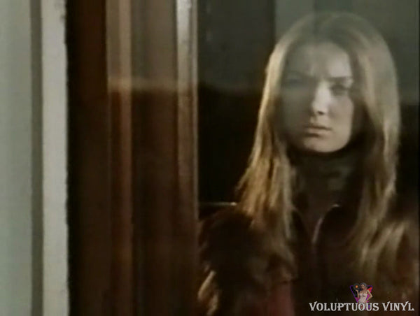 Barbara Bouchet staring outside