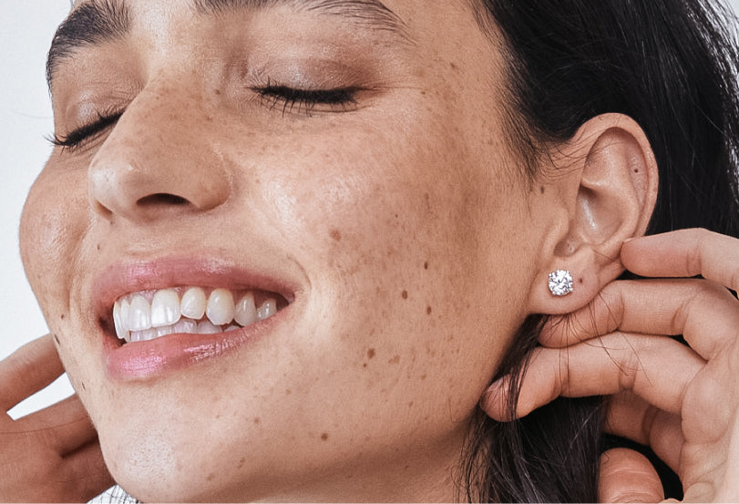 Woman Wearing Butterfly Diamond Studs