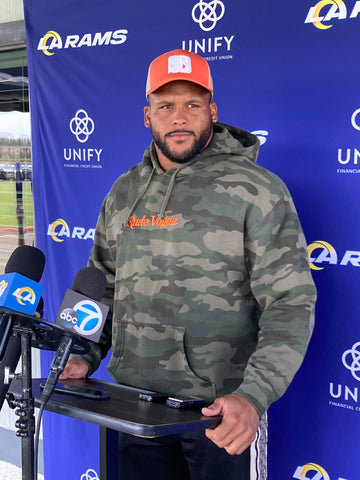 Los Angeles Rams NFL Star Aaron Donald wearing the Rude Vogue Woodland Camo Hoodie during a press conference