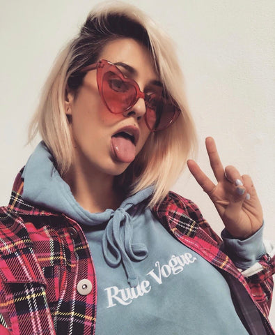 DEV wearing the Washed Blue Rude Vogue Hoodie
