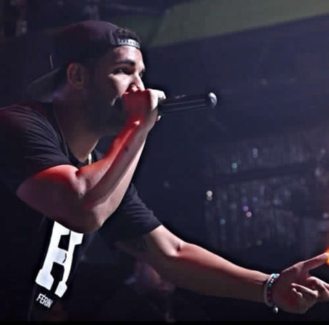 Drake wearing a T-Shirt designed by Rude Vogue