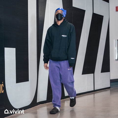 Utah Jazz guard Elijah Hughes wearing the Washed Grape Rude Vogue Sweatpant with a Fear of God Essentials Hoodie and a Du Rag