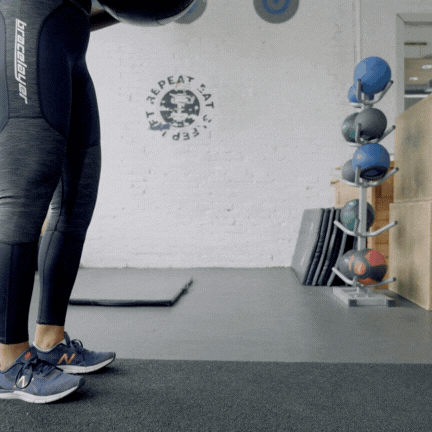 A gif of a person doing a lunge while holding a large kettlebell. Lunges are a core exercise for your knee strengthening routine. Strengthening the knees is possible for everyone: you don't need to use heavy weights to strengthen knees.
