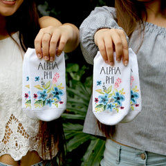 This is an image of sorority Alpha Phi floral watercolor custom printed socks.