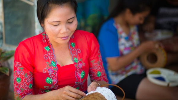 This is an image of two women working on a project funded by Kiva.