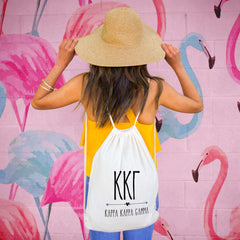 This is an image of a girl wearing the Sorority Name with Boho Design Drawstring Bag.