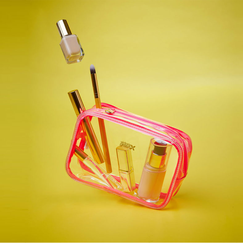 transparent makeup bag for cosmetics with pink trim and zip