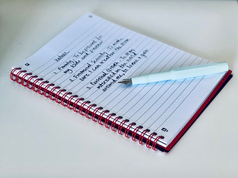 Notebook with list of key values to help you learn how to motivate yourself.
