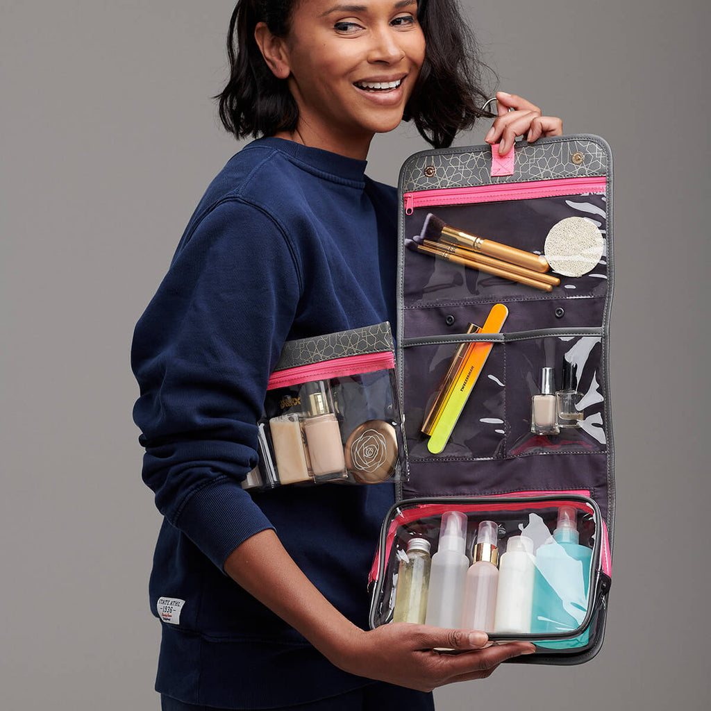 hanging wash bag packed with toiletries