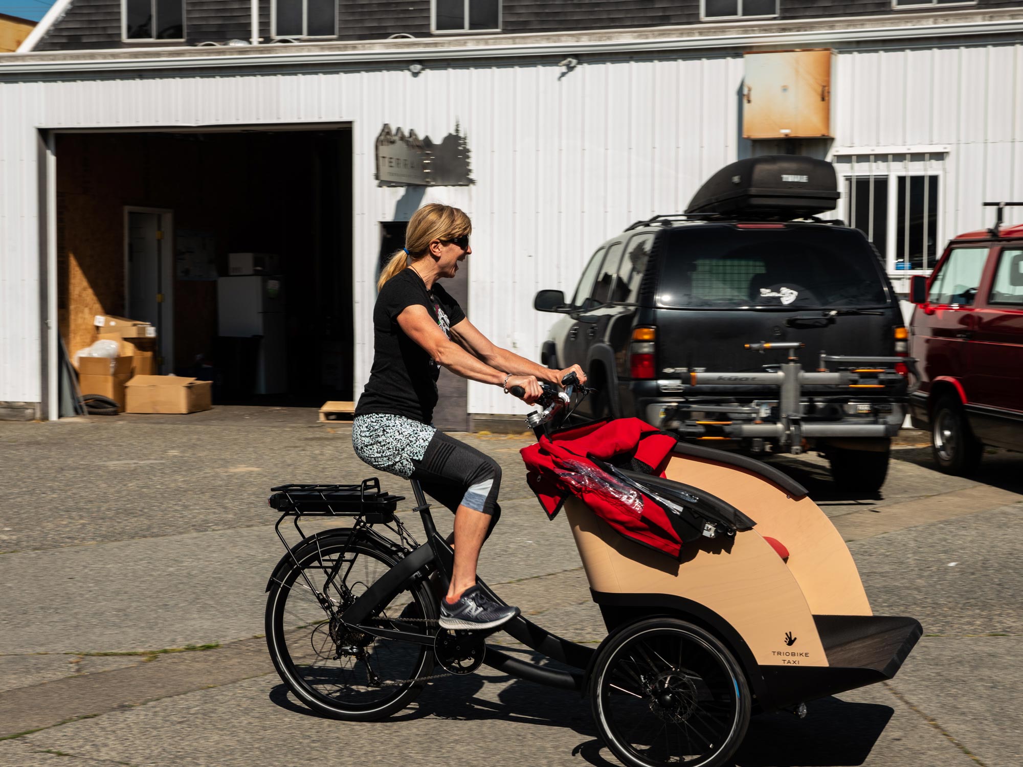 Tammy testing out the newly un-boxed Triobike!