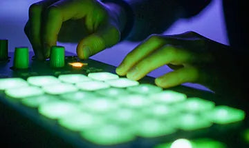 Close Up of hand playing Ableton Push style MIDI controller