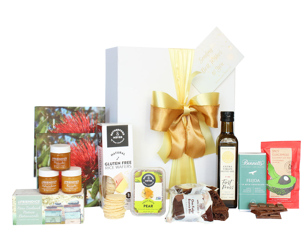 Large luxury white gift box with gold ribbon and a card, packed with napkins, three pots of 40 gram honey, Rutherford and Meyer crackers, fruit paste and gourmet dip mix, 250ml bottle of extra virgin olive oill, Mrs Higgin's chocolate fudge brownie and Bennett's of Mangawhai Chocolate bar