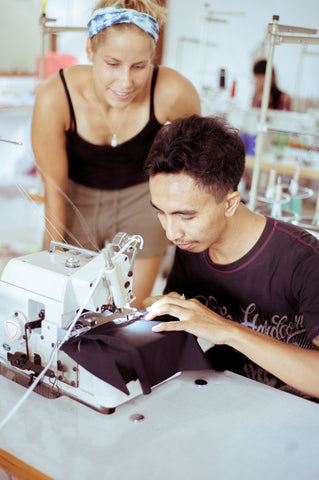 Marie overlooking production of Zealous Clothing