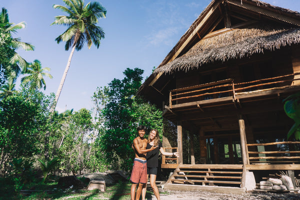 Marjolein Debeer and husband by self-built home in Mentawai