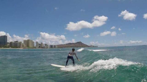 Jocelyn Lu surfing in Hawaii