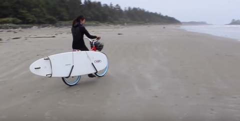 Jocelyn Lu biking to the surf