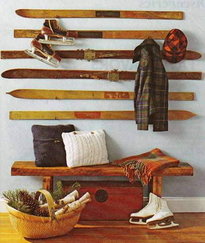 Using recycled vintage skis as wall decor for a ski lodge