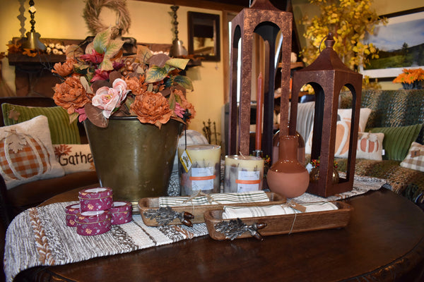 Vintage buckets, glass bottles, and copper pitchers