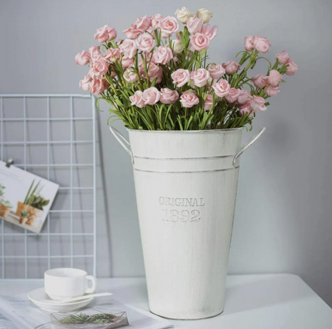 Spring florals in vintage vases and buckets