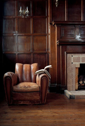 antique leather chair with book