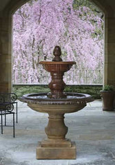 multi-tier fountain in a yard