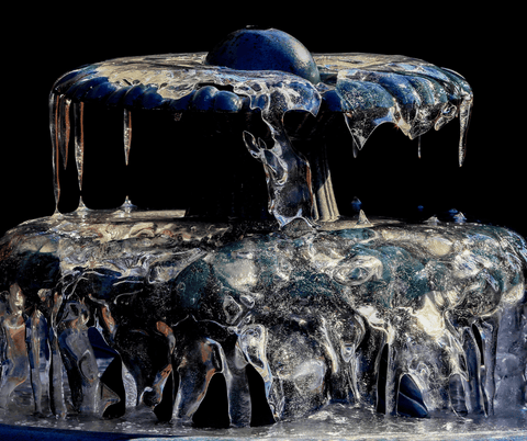 frozen fountain in winter