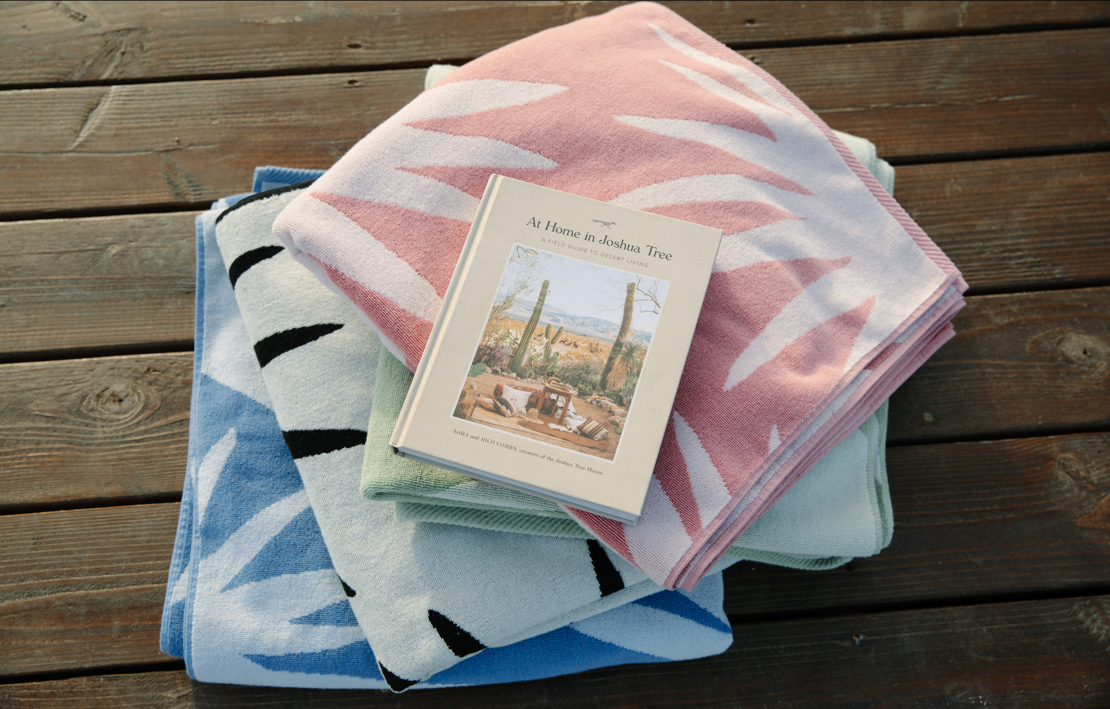 A stack of multi color agave inspired towels. 
