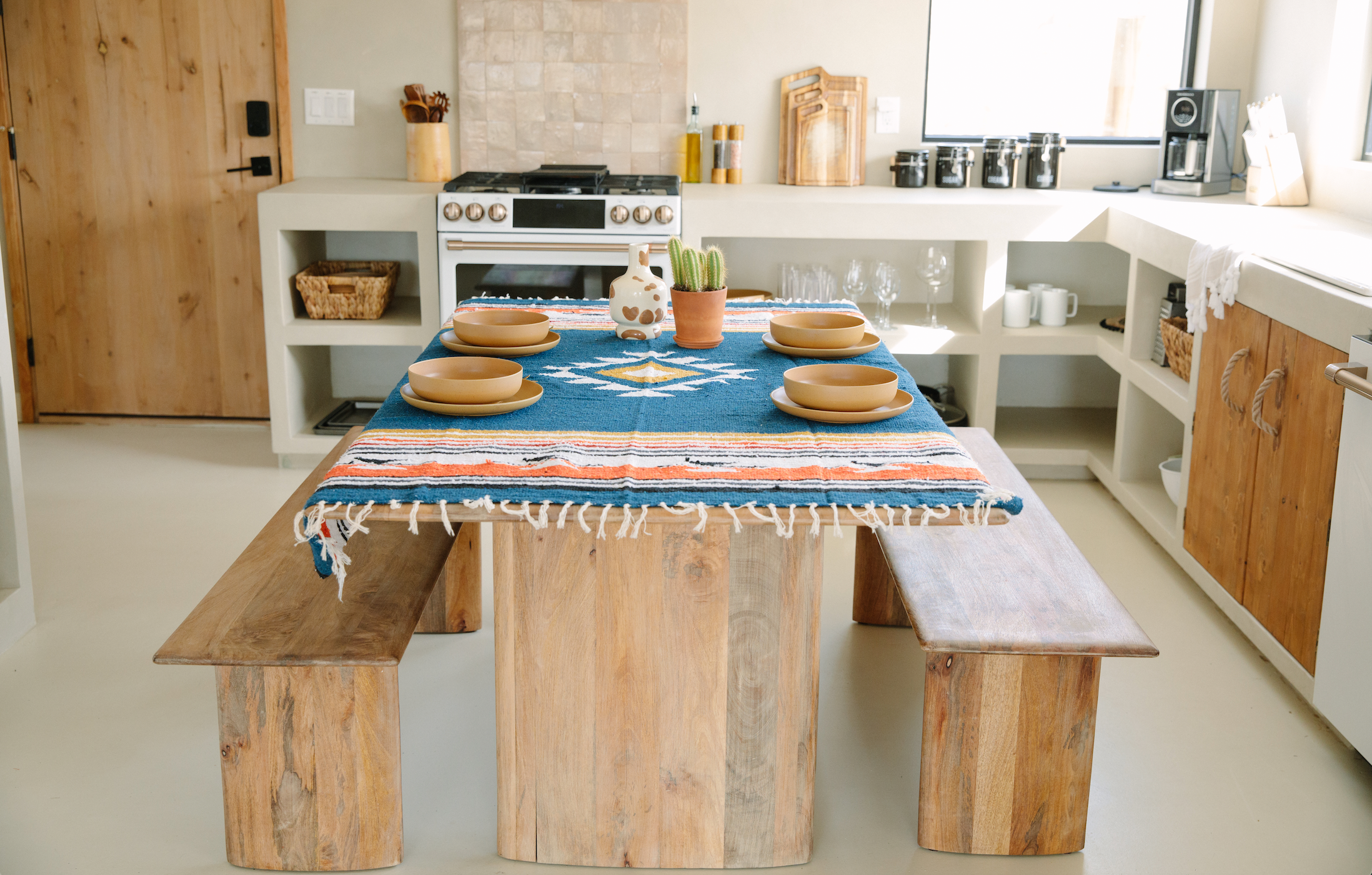 A Mexican Blanket used a tablecloth with a rustic table setting.