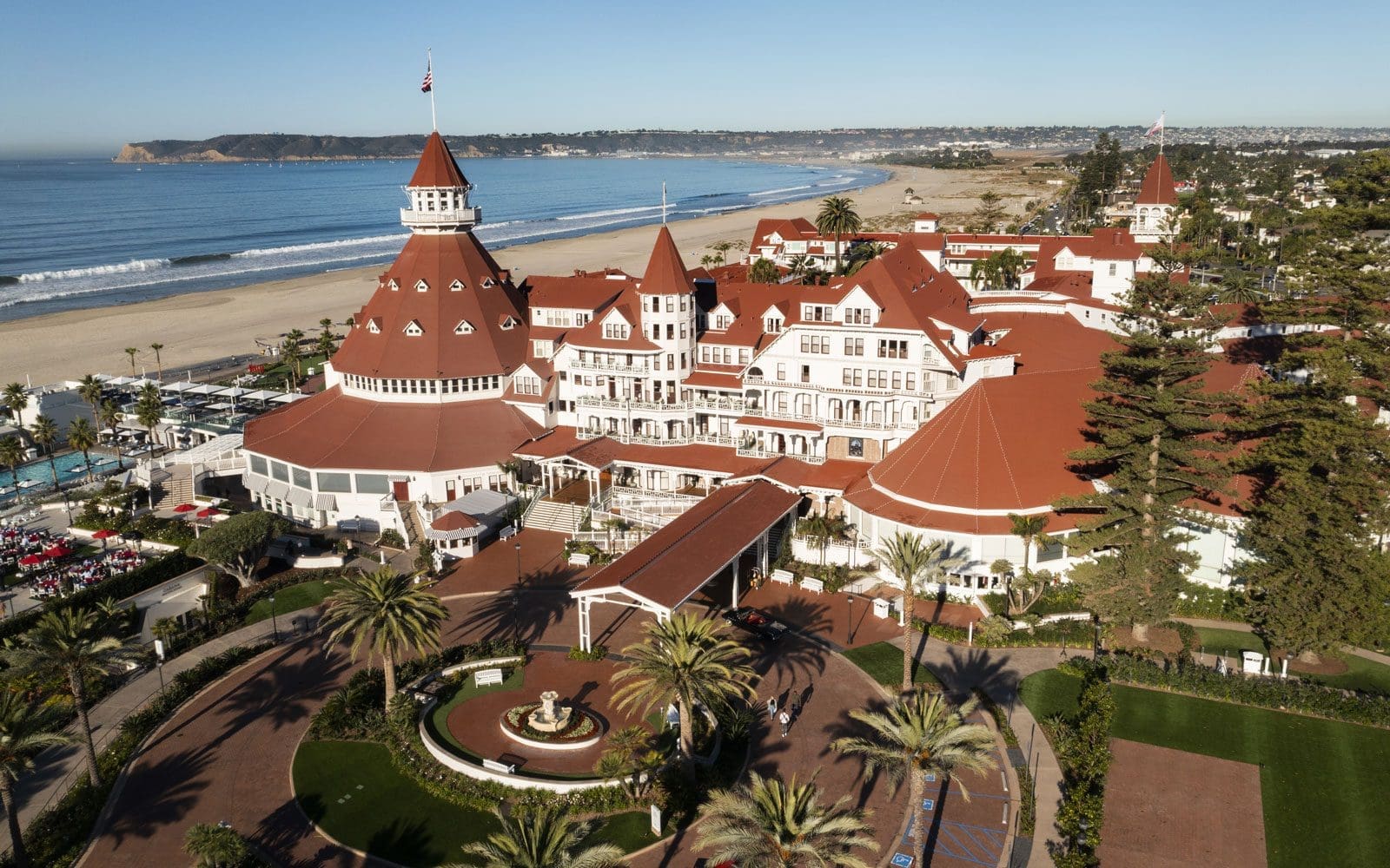 Aerial view of Hotel del Coronado by the beach.