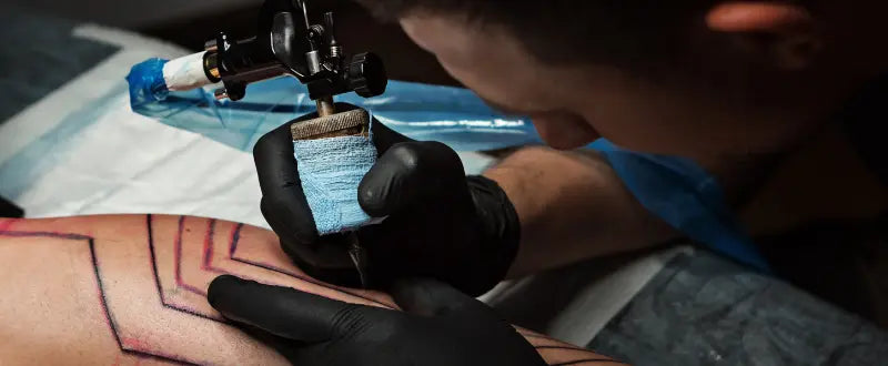 A close up process of making tattoo