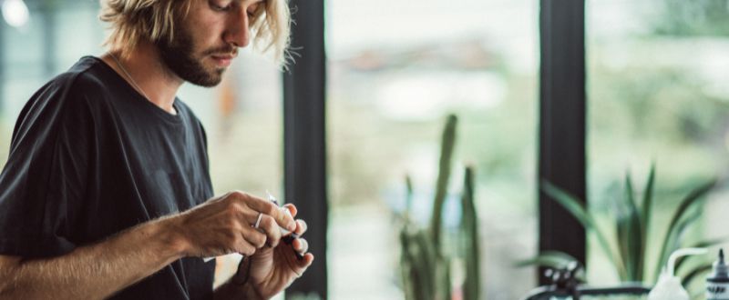 Guy preparing tattoo machine