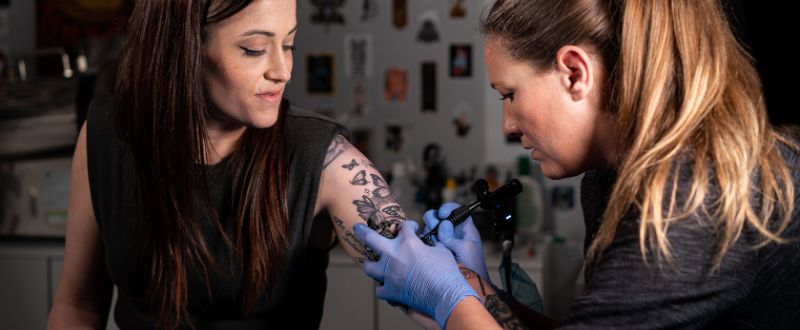 a female client getting a tattoo