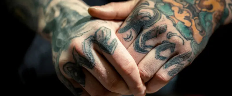 a hand with tattoos
