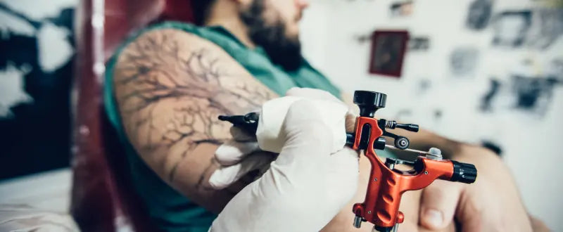 a man getting his tattoo