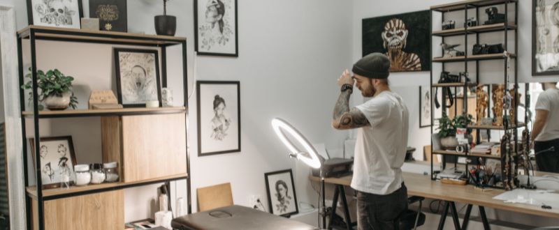a tattoo artist in his studio