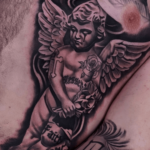 Black and grey cherub tattoo
