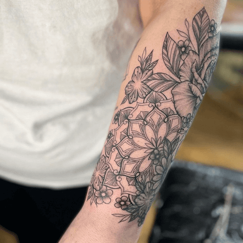Black outline floral tattoo