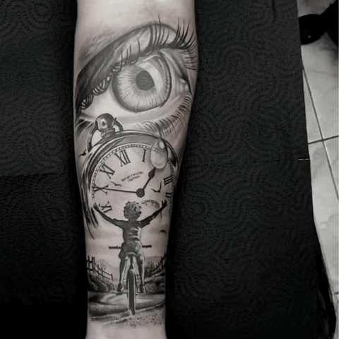 Intricate grey wash tattoo with an eye and clock design