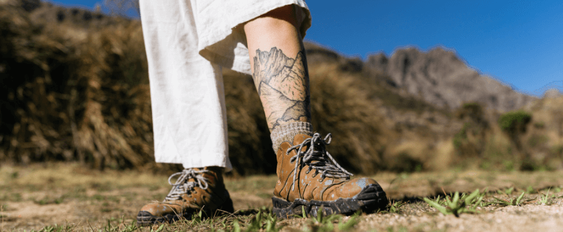 Large mountain tattoo design on leg