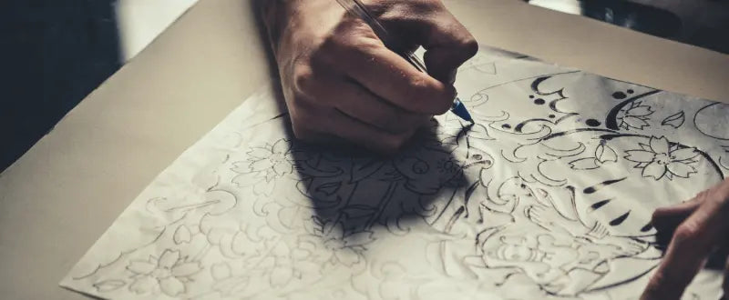 tattoo artist sketching his tattoo designs